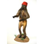 A 20TH CENTURY TAXIDERMY FULL MOUNT MALE CHACMA BABOON Mounted on a naturalistic base with a