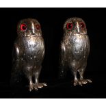 A PAIR OF VICTORIAN NOVELTY SILVER OWL PEPPER POTS Detachable heads set with amber glass eyes and