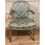 IN THE MANNER OF ROBERT ADAM, AN 18TH CENTURY GILTWOOD FRAMED OPEN ARMCHAIR With an upholstered back