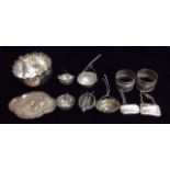 A COLLECTION OF FIVE VICTORIAN AND LATER SILVER TEA STRAINERS With wire handles and pierced bowls,