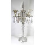 A 19TH CENTURY VENETIAN CLEAR GLASS FIVE BRANCH CANDELABRA Hung with prism drops. (73cm)