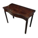 A GEORGE II CHIPPENDALE PERIOD FLAME MAHOGANY SERPENTINE FOLD OVER CARD TABLE Raised on square