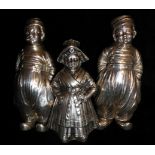 A COLLECTION OF THREE EARLY 20TH CENTURY DUTCH SILVER PEPPER POTS Two modelled as boys, marked 'BHM'