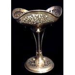 AN EDWARDIAN SILVER TAZZA Lobed shape bowl, with pierced floral decoration and scrolled supports,