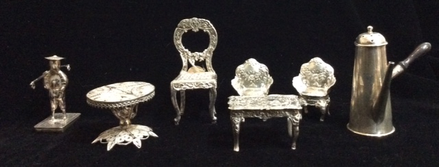 A COLLECTION OF VICTORIAN NOVELTY SILVER DOLLS HOUSE FURNITURE Comprising a chair, hallmarked