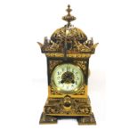 A 19TH CENTURY FRENCH BRASS MANTEL CLOCK Of architectural form with a pierced dome and case,