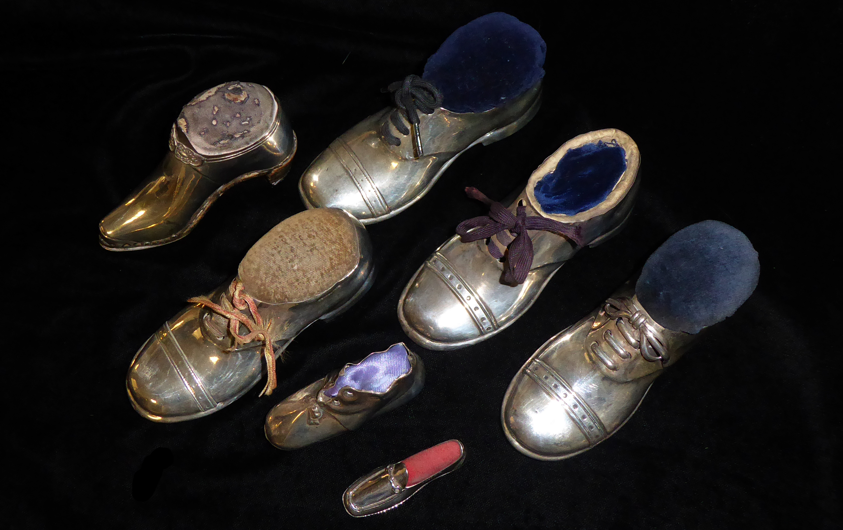 A COLLECTION OF FOUR EDWARDIAN NOVELTY SILVER SHOE PIN CUSHIONS Each having a wooden base, three - Image 2 of 4