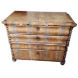 A 19TH CENTURY FRENCH COMMODE The four long drawers fitted with brass escutcheons, flanked by bobbin