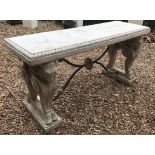 AN IMPRESSIVE REGENCY DESIGN FAUX STONE CONSOLE TABLE The gadrooned top supported on heavy rams head