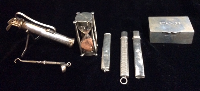 AN EARLY 20TH CENTURY NOVELTY SILVER GOLF BAG AND CLUBS COCKTAIL STICK SET Comprising six clubs,