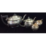 AN EARLY 20TH CENTURY SILVER OVAL BACHELOR'S TEA SET Of plain form, comprising a teapot, sugar basin