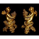 A FINE PAIR OF 19TH CENTURY FRENCH GILT BRONZE FIGURAL CANDLESTICKS Modelled as a pixie and cherub