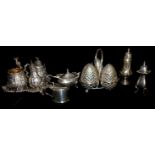 A VICTORIAN SILVER CONDIMENT SET Cast with figural finials and Dutch characters at play, with