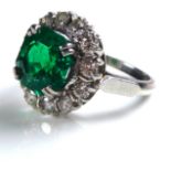 A 19TH/EARLY 20TH CENTURY PLATINUM, NATURAL EMERALD AND DIAMOND RING The single Columbian emerald (