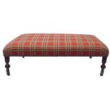 A LARGE VICTORIAN DESIGN FOOTSTOOL Newly upholstered in tartan, raised on reeded legs terminating on