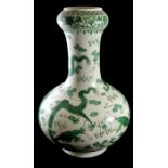 AN ANTIQUE CHINESE PORCELAIN GREEN BOTTLE FORM VASE Five claw dragons chasing a flaming pearl,