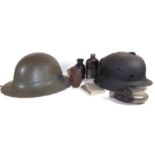 A COLLECTION OF EARLY 20TH CENTURY MILITARY ITEMS Comprising a British World War II Civil Defence