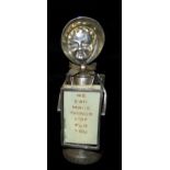 AN EDWARDIAN NOVELTY SILVER SUFFRAGETTE PEPPER POT Wearing a bonnet and holding two ivorine