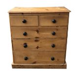 A VICTORIAN PINE CHEST With two short above three long drawers, raised on a plinth base. (98cm x