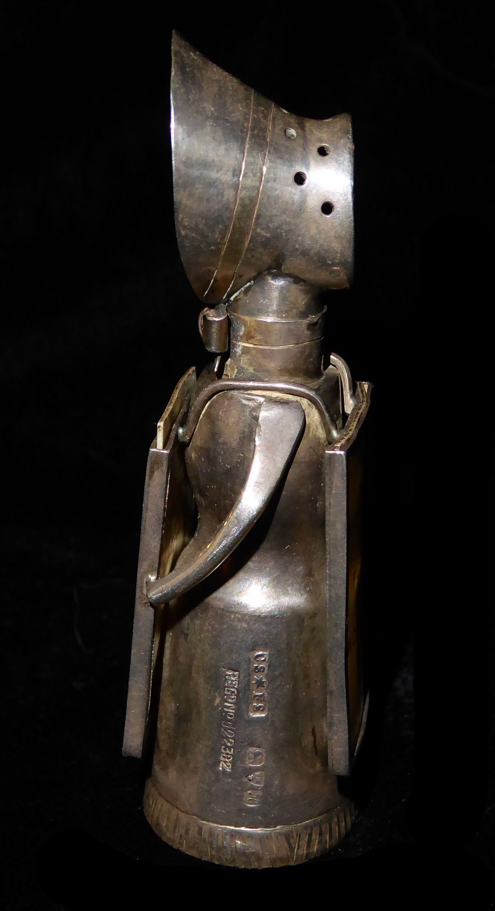 AN EDWARDIAN NOVELTY SILVER SUFFRAGETTE PEPPER POT Wearing a bonnet and holding two ivorine - Image 4 of 6