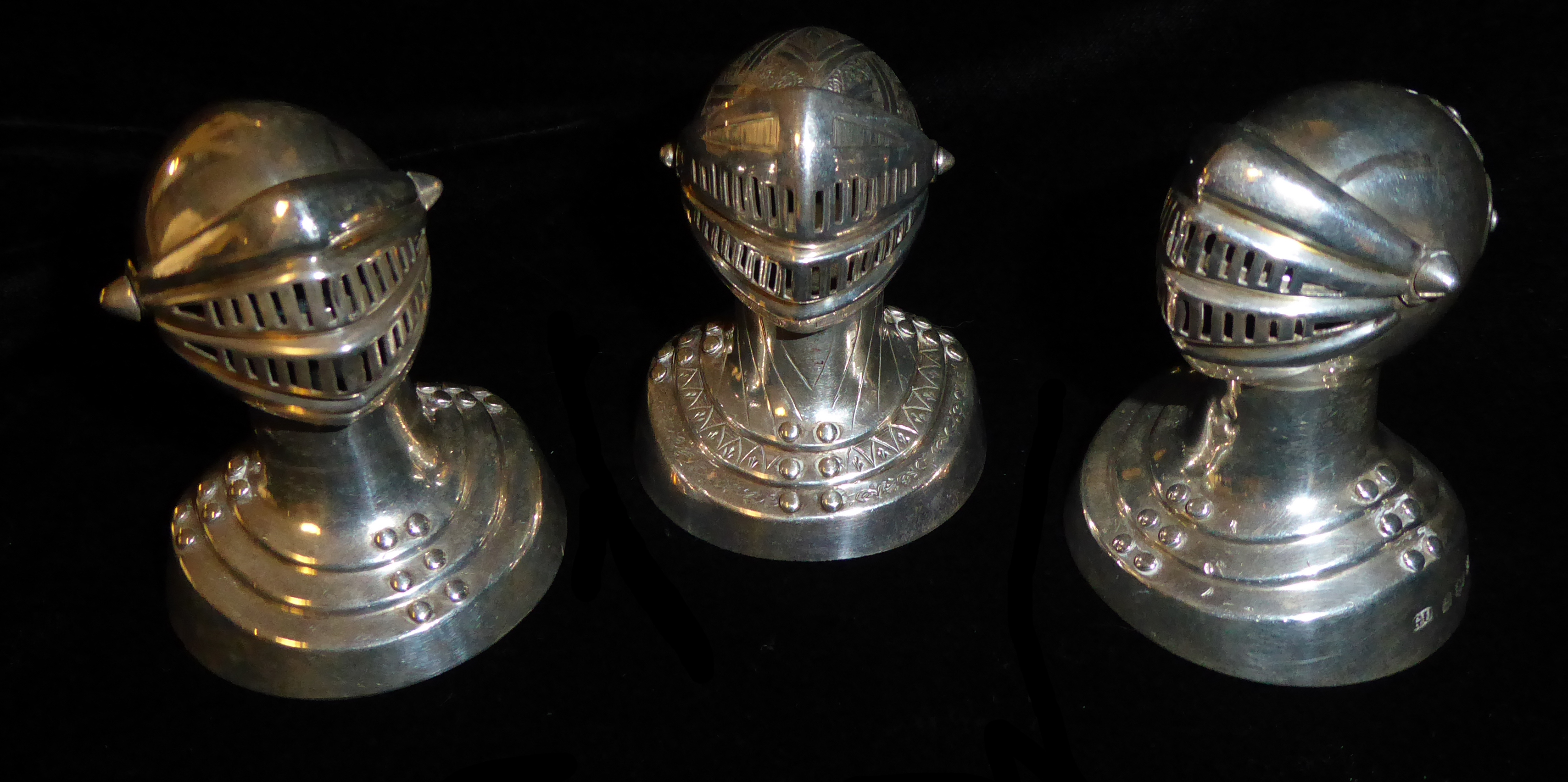 GEORGE UNITE, A COLLECTION OF THREE VICTORIAN AND LATER NOVELTY SILVER PEPPER POTS Modelled as a