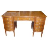 IN THE MANNER OF GILLOWS, AN EARLY 20TH CENTURY SATINWOOD DESK With cartouche top above an