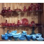 A COLLECTION OF VICTORIAN CRANBERRY GLASS ITEMS Comprising four claret ewers, vases and dishes,