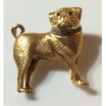 A VINTAGE 18CT GOLD, DIAMOND AND RUBY PUG DOG BROOCH Wearing a diamond encrusted collar, with ruby