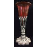 A LARGE VICTORIAN GOTHIC SILVER AND RUBY GLASS TRUMPET VASE The ecclesiastical form pierced silver