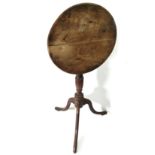 A 19TH CENTURY FRUITWOOD TILT TOP OCCASIONAL TABLE The circular top over a turned column, raised