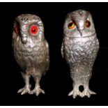 TWO NOVELTY SILVER OWL PEPPER POTS The detachable head set with glass eyes and embossed