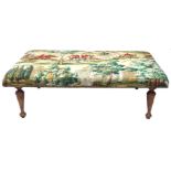 A LARGE VICTORIAN DESIGN FOOTSTOOL With huntsmen and hounds upholstery, raised on turned legs.