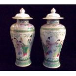 A PAIR OF ORIENTAL FAMILLE VERTE PORCELAIN VASES AND COVERS Onion finial with baluster form body,