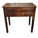 AN 18TH CENTURY OAK SIDE TABLE With brushing slide above two long drawers fitted with brass