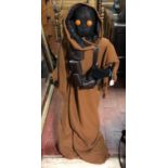 A LIFE SIZE STAR WARS JAWA MODEL WITH LIGHT-UP EYES.