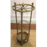 A LATE 19TH / EARLY 20TH CENTURY BRASS STICK STAND Having a circular top with six sections, raised