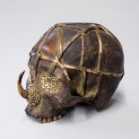 A 19TH CENTURY DAYAK TRIBE HEAD HUNTERS CARVED TROPHY HUMAN SKULL. (h 15cm x w 21.5cm x d 14cm)