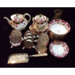 A VICTORIAN PORCELAIN TEA SERVICE Comprising a teapot, a covered sugar bowl and slop basin, eight