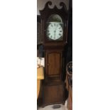 A 19TH CENTURY OAK CASED GRANDFATHER CLOCK The painted dome top dial with Roman numeral chapter