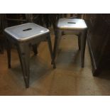 A PAIR OF INDUSTRIAL STEEL STOOLS. (31cm x 31cm x 45cm)