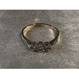 A 9CT GOLD DIAMOND RING, THREE DIAMONDS SET IN ROW WITH DIAMONDS ON SHOULDER SIZE R