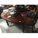 MAHOGANY OVAL TABLE WITH TURNED LEGS AND CASTORS