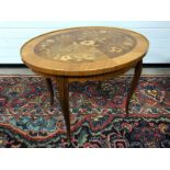ANTIQUE STYLE OVAL WALNUT SIDE TABLE WITH ROSEWOOD, OLIVEWOOD AND MAPLE FLORAL MARQUETRY INLAY.