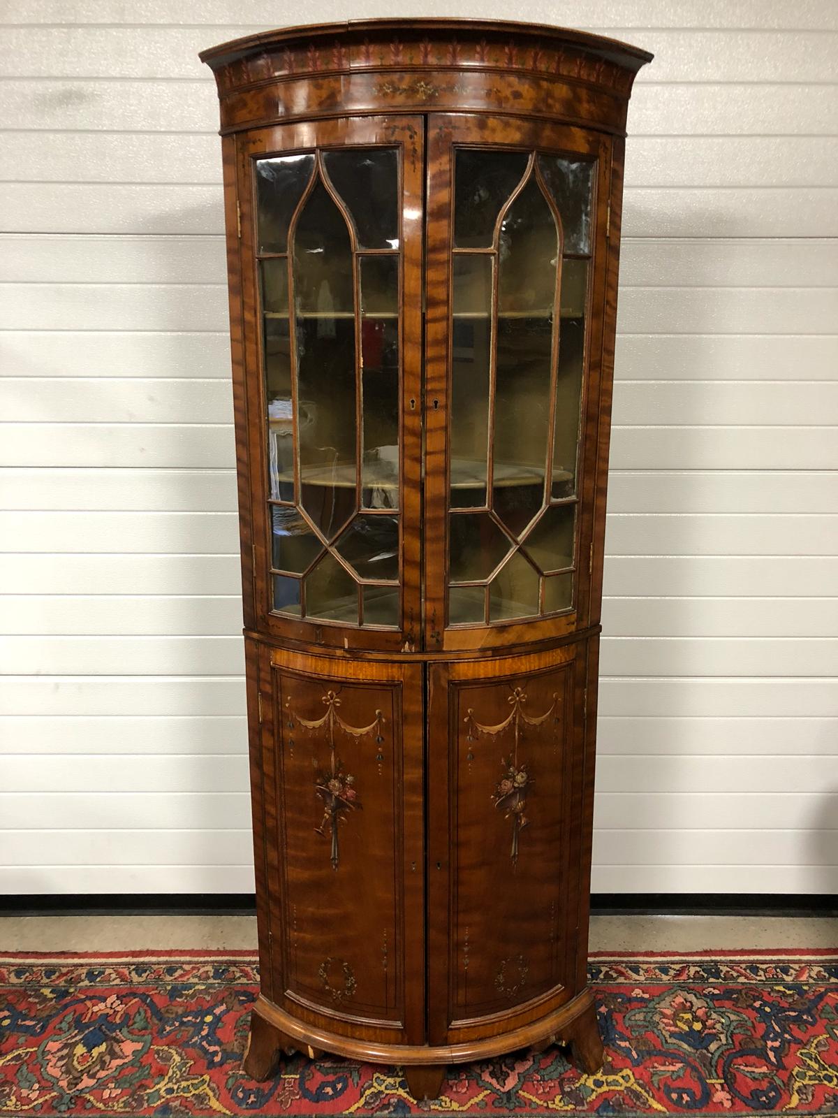 VICTORIAN TWO PIECE CORNER CABINET FINISHED IN GUILTED MAHOGANY VENEER, WITH DECORATIVE HAND PAINTED