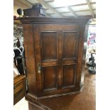 SMALL VICTORIAN OAK CORNER CUPBOARD WITH 4 PANEL DOOR WITH BRASS DROP HANDLE AND AN INTERNAL SHELF ,