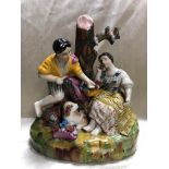 LATE STAFFORDSHIRE FIGURE OF A COUPLE PICKING FLOWERS