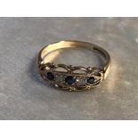 A 9CT GOLD SAPPHIRE AND DIAMOND RING HAVING A FILIGREE DESIGN WITH THREE SAPPHIRE AND TWO DIAMONDS