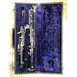 CIRCA 1960'S EBONY AND WHITE METAL CLARINET STAMPED F. BUINON SOLE DISTRIBUTES DALLAS LONDON TO