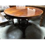 GEORGIAN CIRCULAR SNAP TOP TABLE ON TAPERED OCTAGONAL PEDESTAL WITH CLAW FEET RAISED ON CASTORS