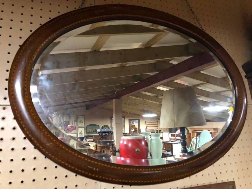 VICTORIAN OVAL MIRROR WITH MAPLE AND EBONY BANDING AND ORIGINAL BEVELLED EDGE GLASS